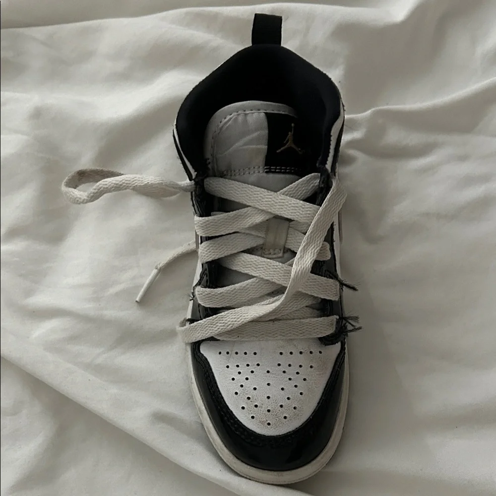 Nike Kids Black and White Sneakers with Gold Accents